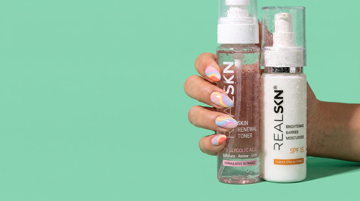 RealSKN Skin Renewal Toner and Brightening Barrier Moisturiser held in hand on a mint background